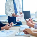 Businessman Presenting Strategy Plan in Meeting